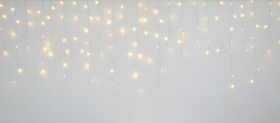 Wall Mural - Christmas light decoration blurred festive gold bokeh light on white background