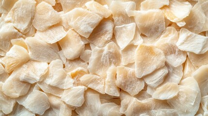 Poster - Top view of scattered salted cod fillet slices on a wooden counter background for culinary and food photography compositions