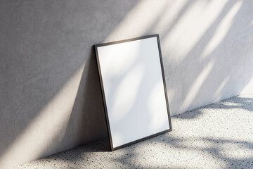 Aufkleber - Blank frame standing on terrazzo floor near wall with textured stucco surface, lit by soft light and shadows. Modern artwork display concept. 3D Rendering