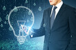© Who is Danny - Businessman holding smartphone with glowing digital lightbulb hologram, symbolizing innovation and technology concept.