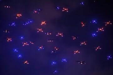 Fototapete - Drones create a vibrant light show in the evening sky