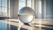 © Olga - Glass sphere on reflective table by window