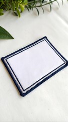 Poster - Blank rectangular fabric patch mockup with stitched border on white background, perfect for branding design.