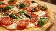 © Aisha - A classic Italian pizza topped with fresh basil, mozzarella, and tomatoes.