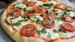 © Aisha - A classic Italian pizza topped with fresh basil, mozzarella, and tomatoes.