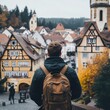 © basketman23 - Scenic View of Man Overlooking Quaint Village