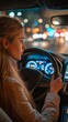 © tongpatong - A woman traveler is seen driving a modern car while utilising the navigation on the screen.