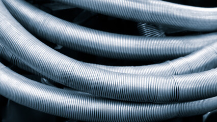 Poster - A long silver pipe is shown in the image. It is bent and twisted. The pipe is made of metal