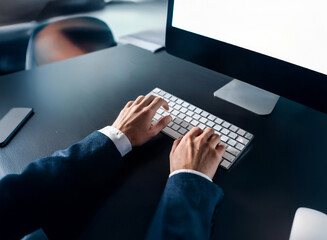 Aufkleber - Close-up of hands in a suit typing on a sleek, modern keyboard in front of a desktop computer with a blank screen.  The scene suggests work, efficiency, and technology.