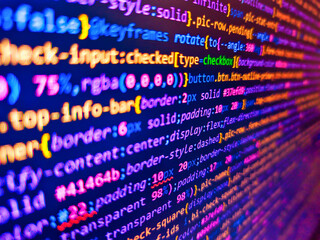 blue banner with php language code on development monitor. remote work search. color coding on scree