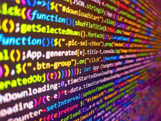 fragment of a sequin fabric. closeup view of software code on a computer screen with blurred backgro
