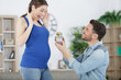 © auremar - man asks his pregnant wife to get married