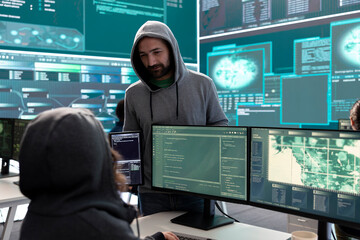 Poster - governmental hackers analyzing big data for cyber threat detection, working at agency desks. profess