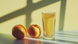 Fresh oranges and glass of orange juice in soft sunlight