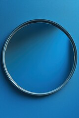 Poster - Circular mirror reflecting light on a vibrant blue wall in a modern interior setting