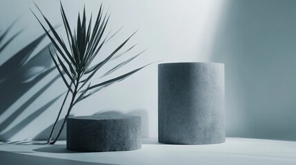 Poster - A minimalist arrangement featuring geometric stone shapes and a palm leaf casting shadows.