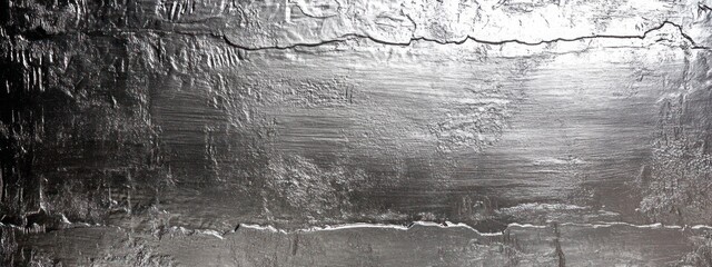 Poster - A textured metallic surface with varied shades and patterns, suggesting industrial material.