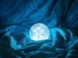 © Digital Sensei - A glowing moonstone resting on a bed of velvet