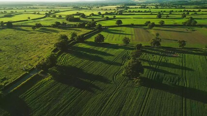 Wall Mural - Aerial view of sunset over the Cheshire rural landscape with green fields