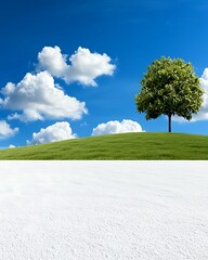 Wall Mural - winter background silence concept, lush green hill with a solitary tree against a bright blue sky an