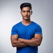 © ZentroStock - Young man in blue t-shirt with crossed armsAI Generated image