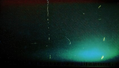 Wall Mural - abstract grainy film texture with gradient of deep green to black, featuring subtle scratches and li