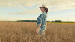 © artifex.orlova - Woman Professional Agronomist Inspecting golden Farmland At Sunset. Agriculture Concept. Ecological Area With Organic Farm. Moves slowly.