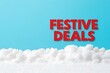 © Pixelbiz - Christmas sale limited-time concept. A bright blue background features fluffy white clouds with bold red text reading 'FESTIVE DEALS,' suggesting a promotional offer or seasonal sale.