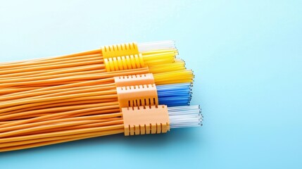 Poster - A Close-up of Colorful Fiber Optic Cables on Blue Background