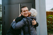 © Westend61 - Mother and son hugging affectionately outdoors in the city.