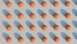 © Westend61 - 3D rendering of a pattern of basketballs with shadows.