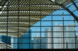 © Westend61 - Singapore Marina Bay area cityscape with modern skyscrapers visible through glass windows.