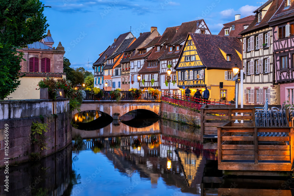 Charming evening view of Little Venice in Colmar, Alsace with medieval half-timbered houses.
