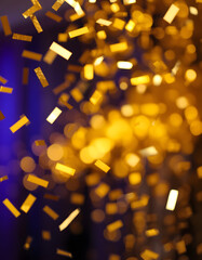 Gold falling Rectangle foil confetti. Festive pattern, blurry foreground