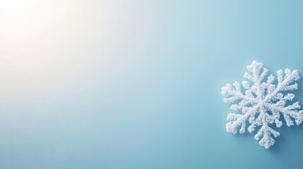 Aufkleber - Close-up view of a single, detailed white snowflake set against a smooth blue gradient background, providing a serene and fresh winter feel