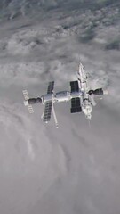 Wall Mural - Vertical Shot of the Russian Mir Space Station Orbiting Planet Earth over a Hurricane