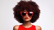 © Ketanoff - Beauty portrait of African American girl in stylish red clothes on white background. Smiling dreamy beautiful girl with afro hightail. Curly black hair