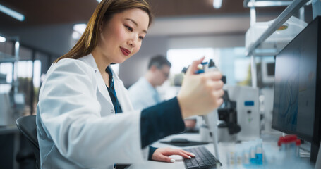 Leinwandbilder - Portrait of a Beautiful Asian Female Scientist Using Micro Pipette for Medical Research Project. Advanced Scientific Lab for Medicine, Biotechnology, Microbiology Development