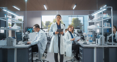 Aufkleber - Group of Scientists in White Lab Coats Working in a Workplace, Sitting Behind Desks and Using Computers. Young Creative People Working in a Research Laboratory