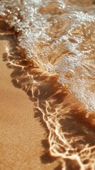 Poster - Gentle waves caress the Mocha Mousse sand, creating intricate patterns as golden light reflects off the water. This serene moment captures the beauty of nature at dusk