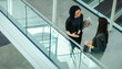 © Jacob Lund - Top view of colleagues discussing business in modern office
