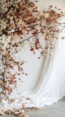 Aufkleber - Blooming cherry blossom branches hanging over white curtain in photo studio