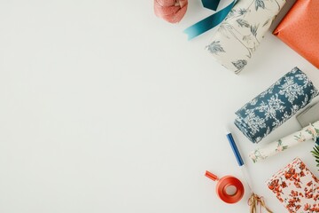 Aufkleber - Various gift wrapping materials are beautifully arranged with decorative papers, ribbons, and cards, leaving ample space for personal messages. Generative AI