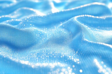 Shiny blue fabric glittering in the light, soft and elegant texture