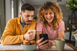 © Miljan Živković - Happy couple have breakfast and cup of coffee at home morning routine