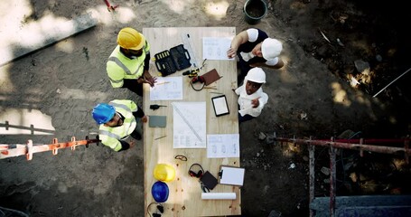 Poster - Collaboration, engineering and planning with construction worker team on building site from above. Architecture, meeting and infrastructure with industrial people at table for design discussion