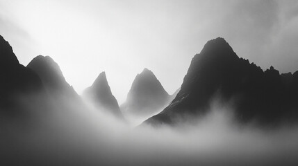 Wall Mural - Ghostly silhouettes of mountains rising through the fog, ethereal beauty.