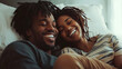 © Birgit Reitz-Hofmann - Happy afro american couple relaxing together in bed