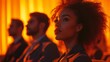 © addymawy - Woman With Afro Attentively Listening In A Group Setting