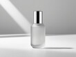 © Png - Video - Photo - Elegant frosted glass bottle with a silver cap, set against a soft light background, ideal for product showcasing.